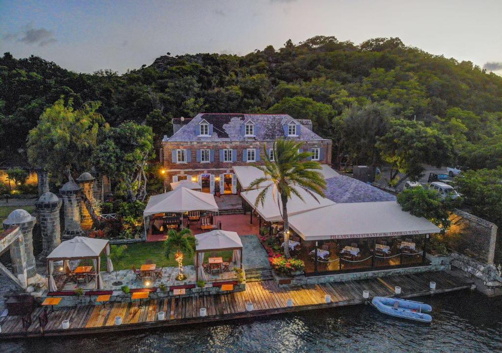 an aerial view of a house on the water at Admiral's Inn and Gunpowder Suites in English Harbour Town