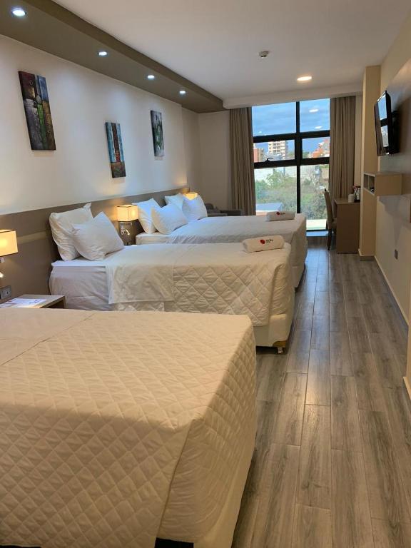 Postel nebo postele na pokoji v ubytování Hotel Sun