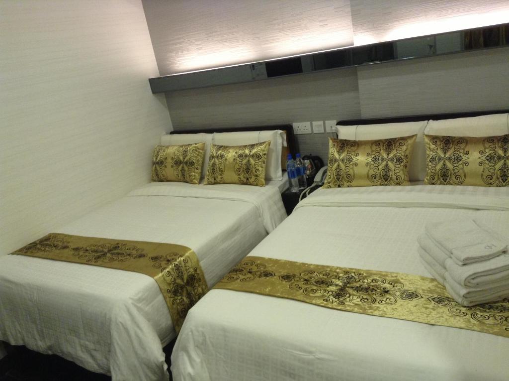 Postel nebo postele na pokoji v ubytování California Hotel