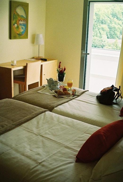 Postel nebo postele na pokoji v ubytování INLIMA Hotel & Spa