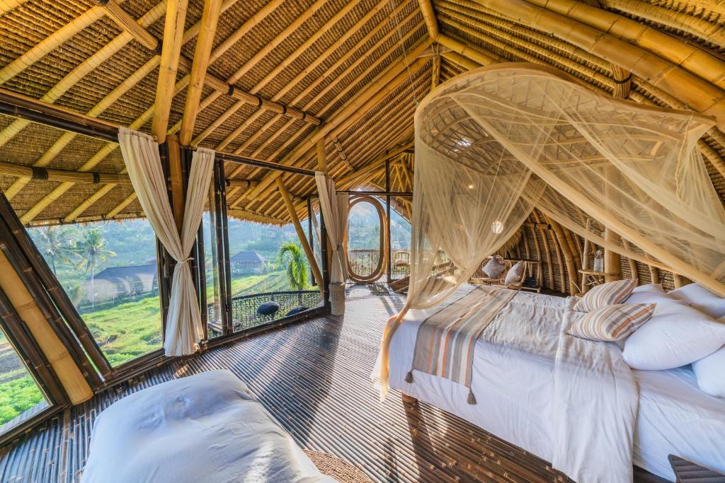 Ένα ή περισσότερα κρεβάτια σε δωμάτιο στο Veluvana Bali