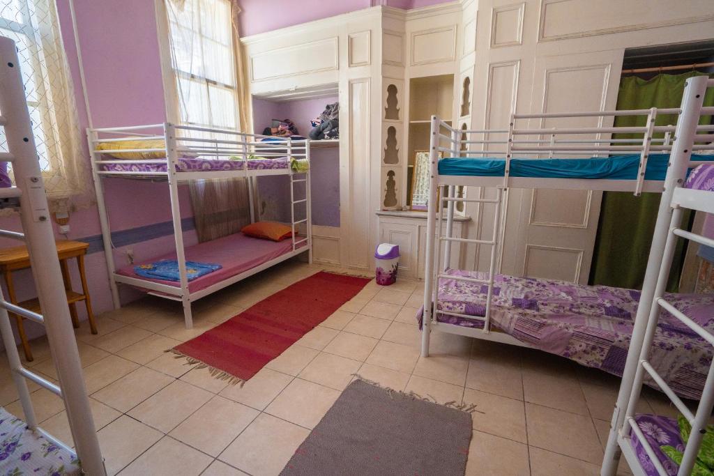 Postel nebo postele na pokoji v ubytování Lotus Garden Hostel Izmir