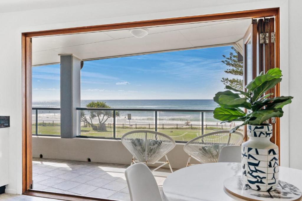 a dining room with a view of the ocean at Sea Salt - Lennox Head in Lennox Head