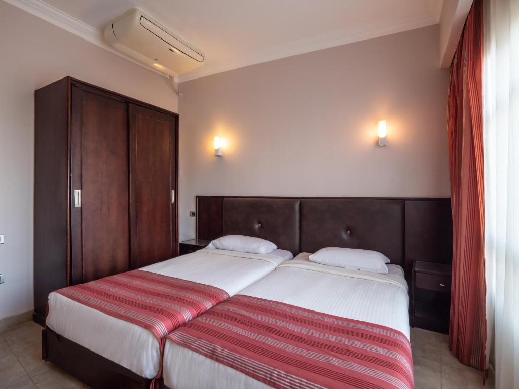 Postel nebo postele na pokoji v ubytování Sunny Days Mirette Family Resort