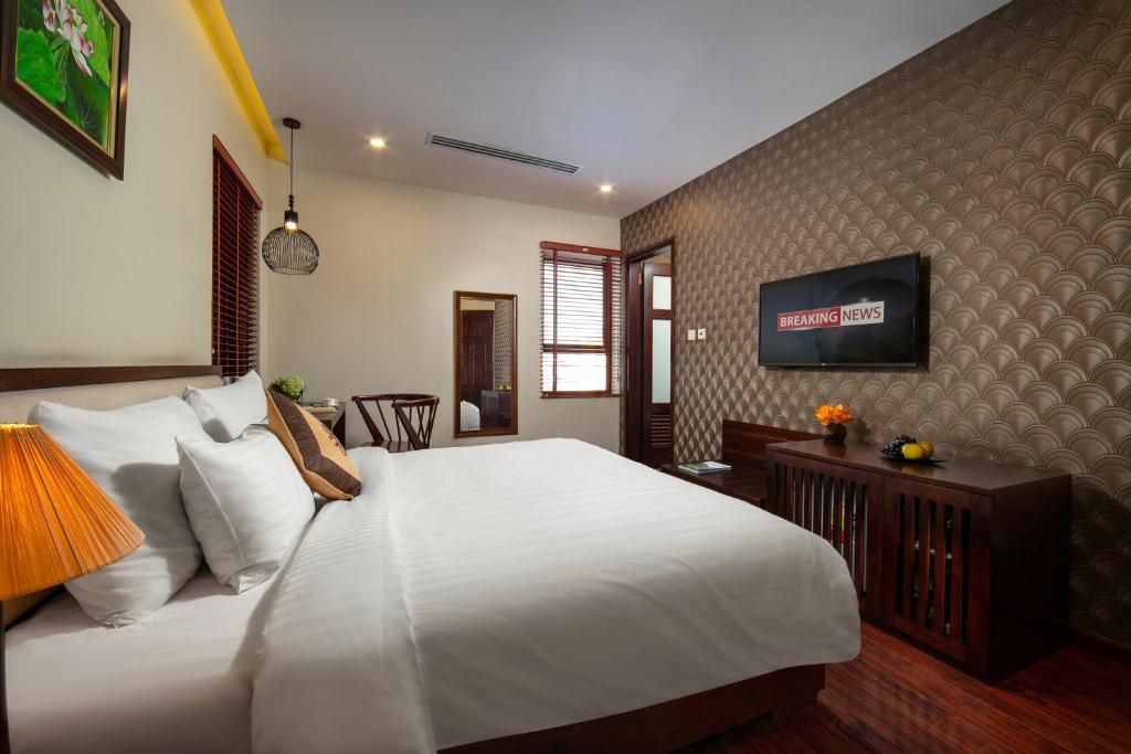 TV a/nebo společenská místnost v ubytování Midori Boutique Hotel