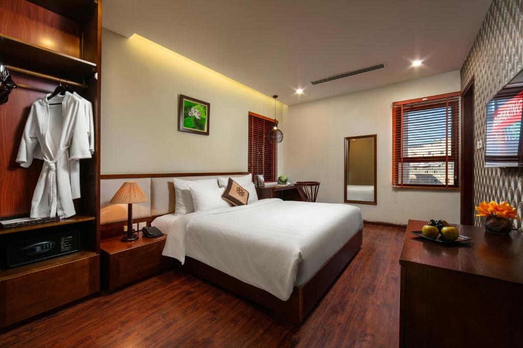Postel nebo postele na pokoji v ubytování Midori Boutique Hotel