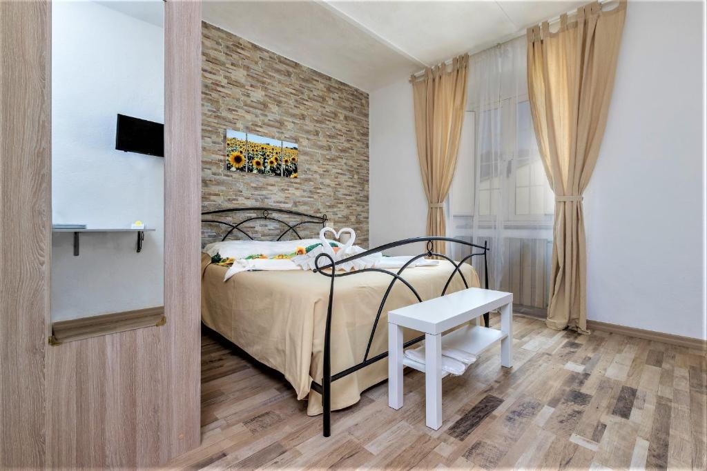 A bed or beds in a room at B&B Maremma's dream