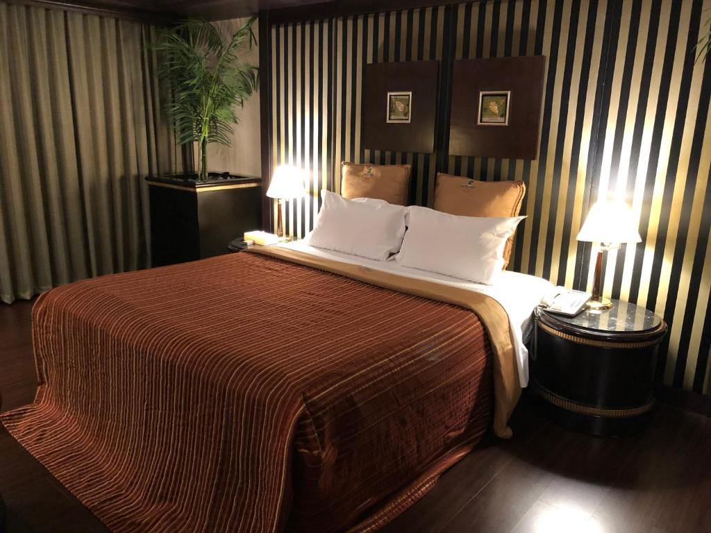 Voodi või voodid majutusasutuse Love Tree Motel toas