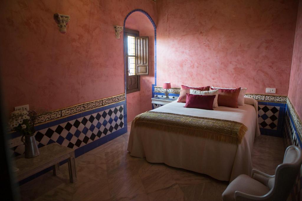Posteľ alebo postele v izbe v ubytovaní La casa del Cipres una casa con historia