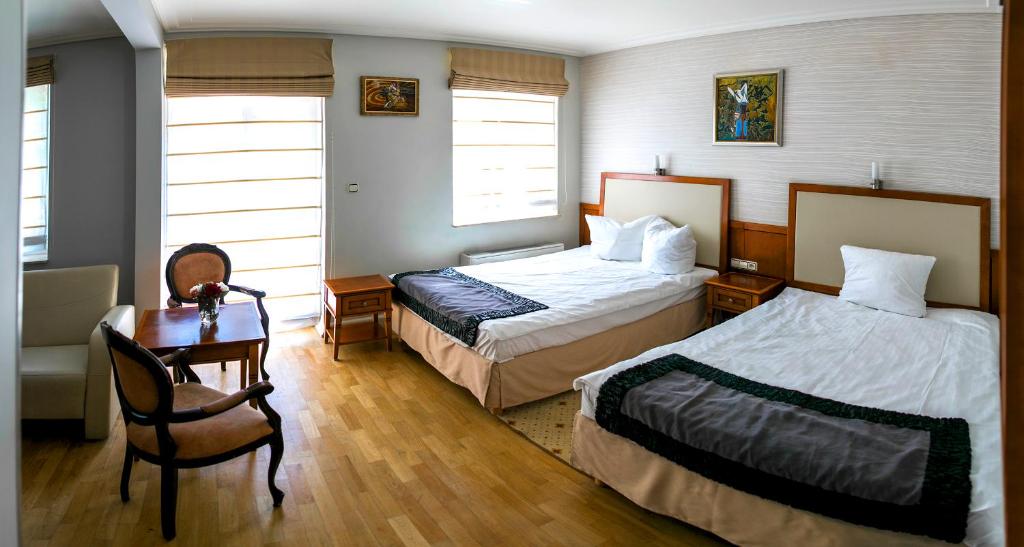 Postel nebo postele na pokoji v ubytování Hotel Apollo