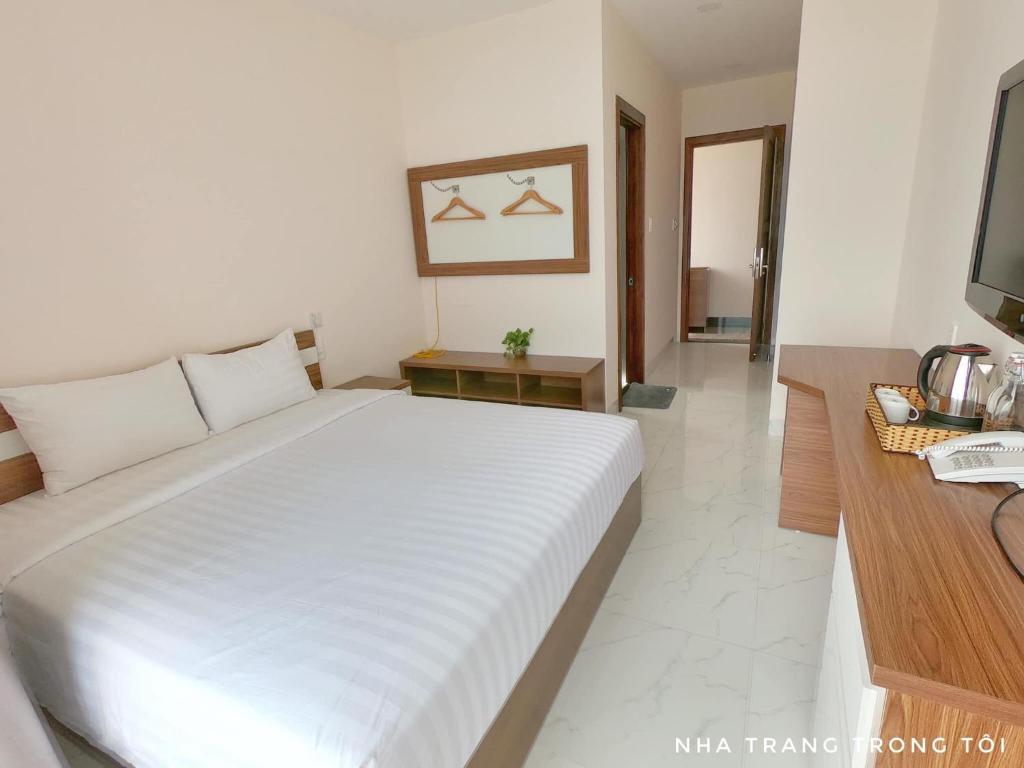 Postel nebo postele na pokoji v ubytování Khách sạn CLIFFHOUSE NHA TRANG