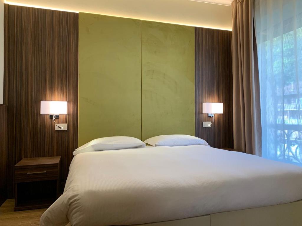 Postel nebo postele na pokoji v ubytování Hotel Brescia