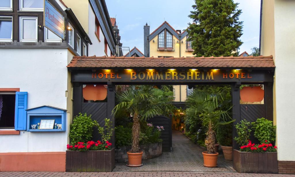 a hotel building with a sign that reads hotel bonnensteinhelm hotel at Hotel und Restaurant Bommersheim in Eschborn