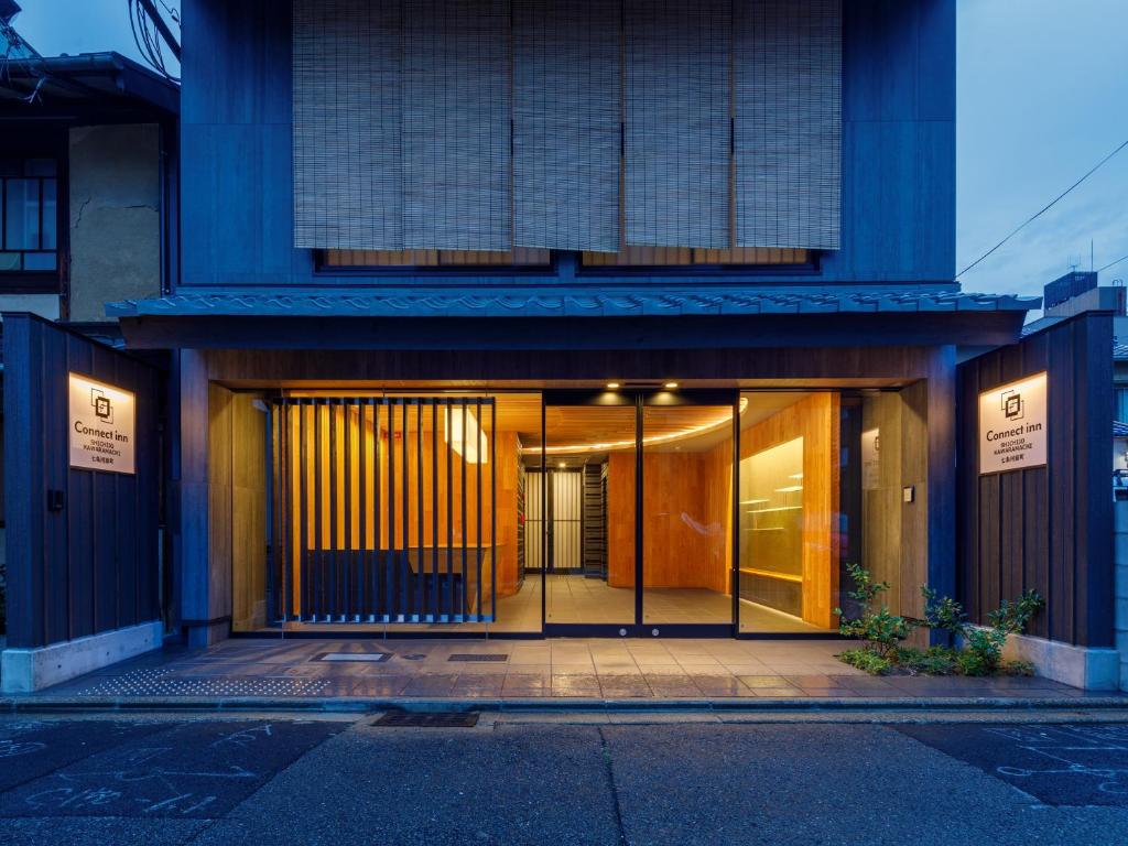 an entrance to a building with glass doors at Connect inn Shichijo-Kawaramachi in Kyoto