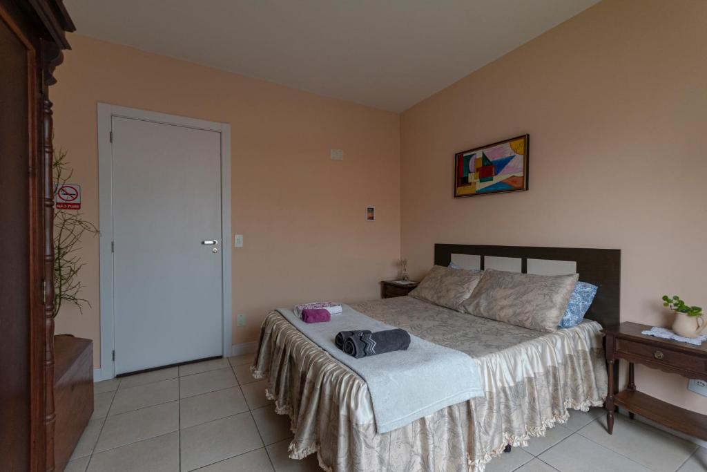 Postel nebo postele na pokoji v ubytování Suítes Balneário Camboriú