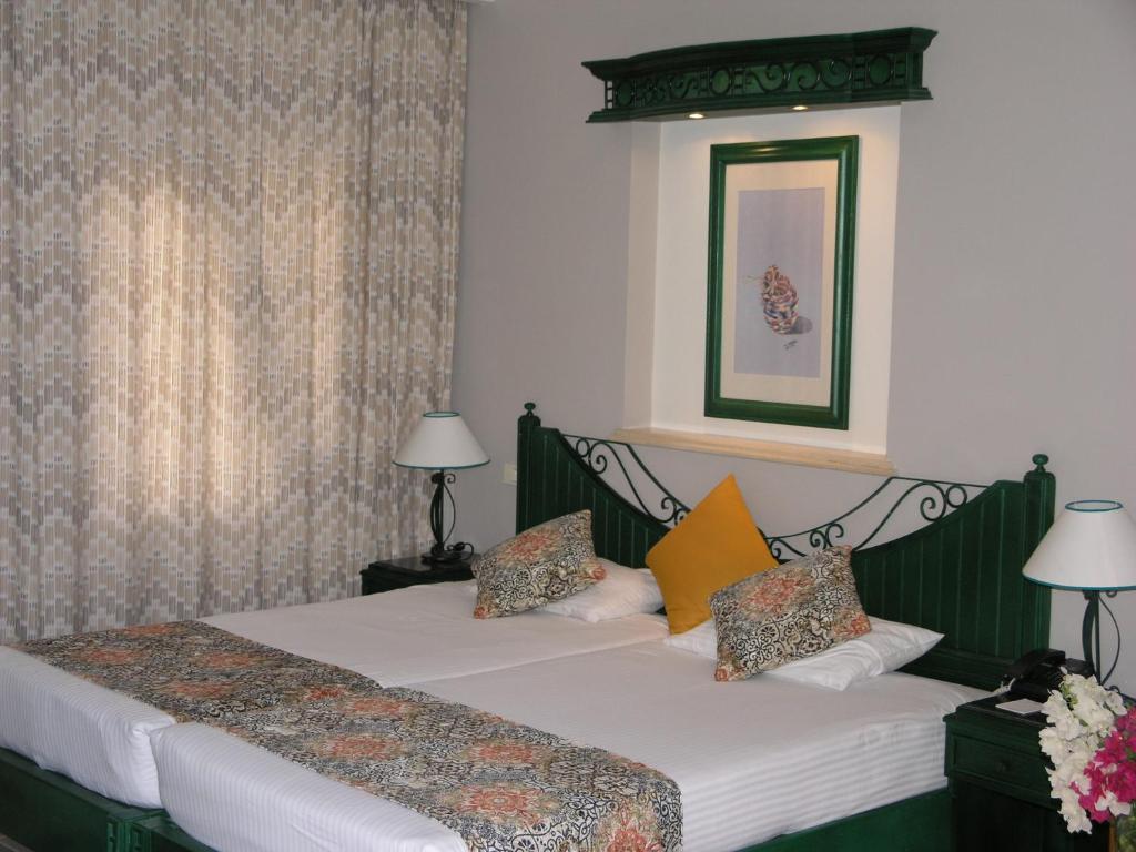 Postel nebo postele na pokoji v ubytování Swiss Inn Resort Dahab
