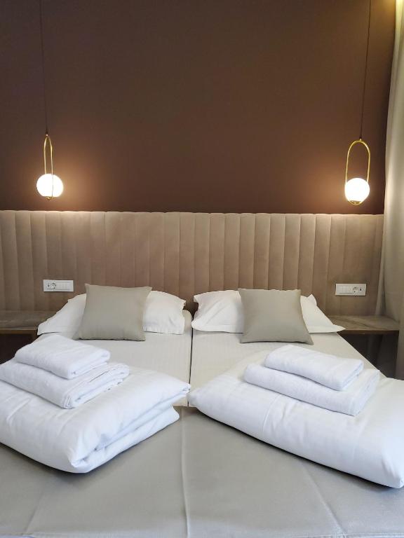 Bošket Luxury Rooms房間的床