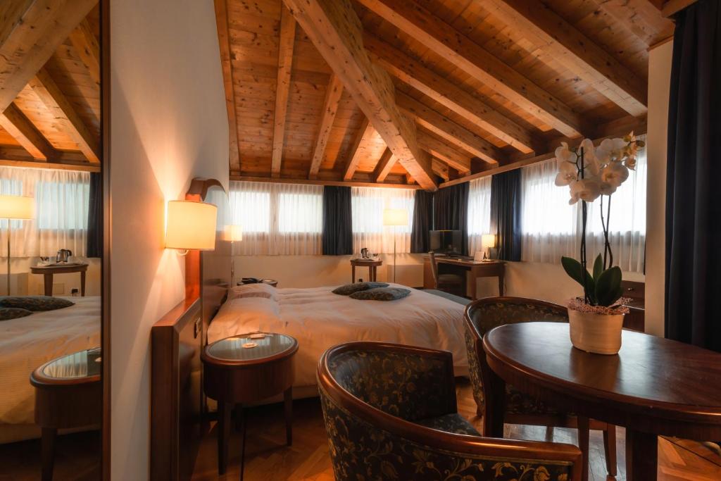 Postel nebo postele na pokoji v ubytování Hotel Alla Torre