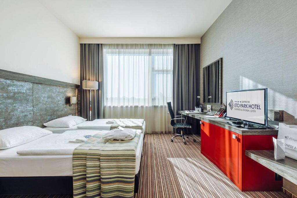 Posteľ alebo postele v izbe v ubytovaní ETO Park Hotel Business & Stadium