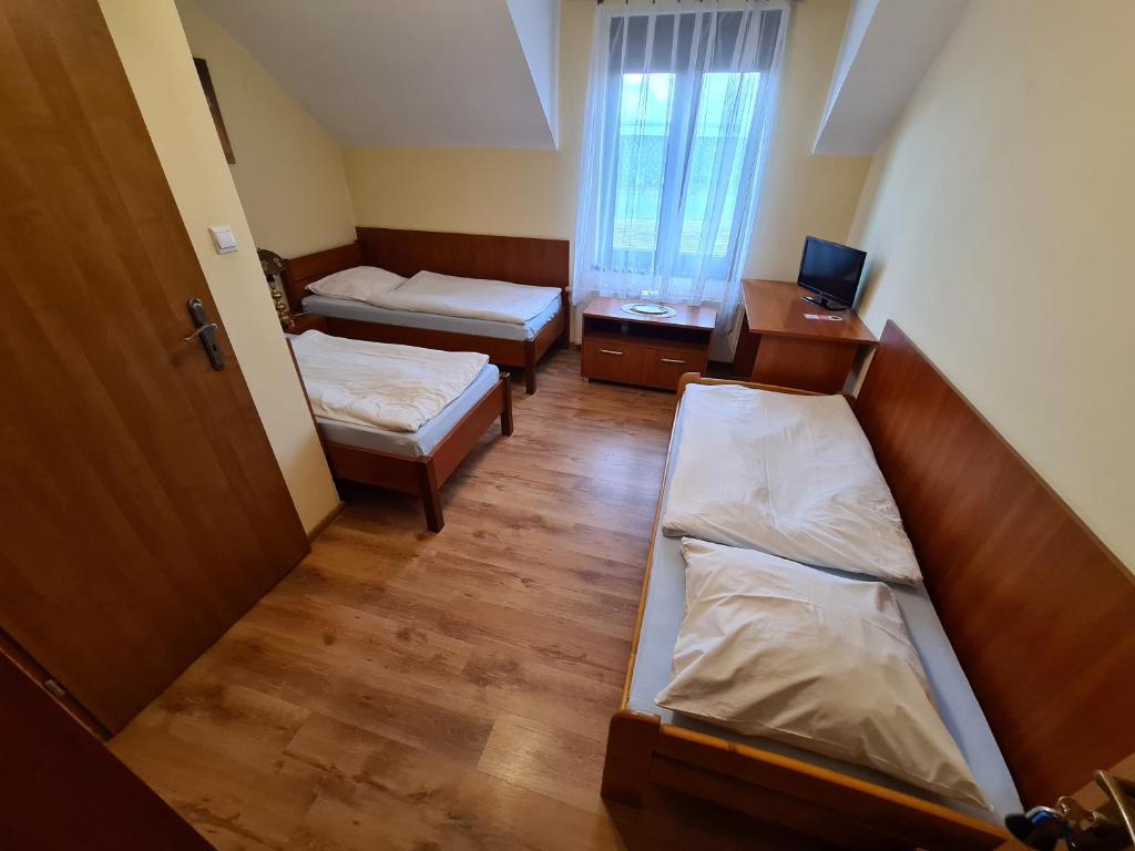 Postel nebo postele na pokoji v ubytování Zajazd Motel Staropolski