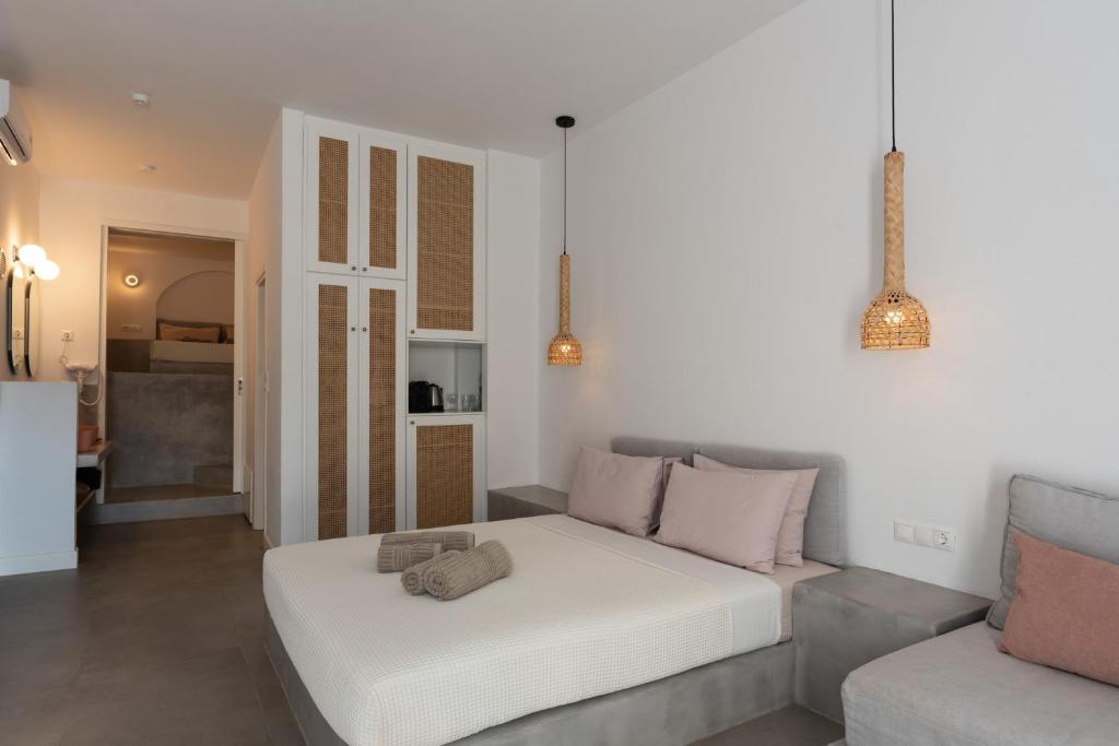 Postel nebo postele na pokoji v ubytování Ihthioessa Boutique Hotel