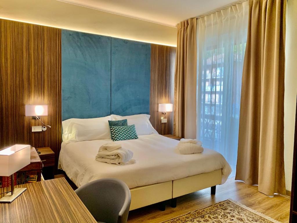 Postel nebo postele na pokoji v ubytování Hotel Brescia
