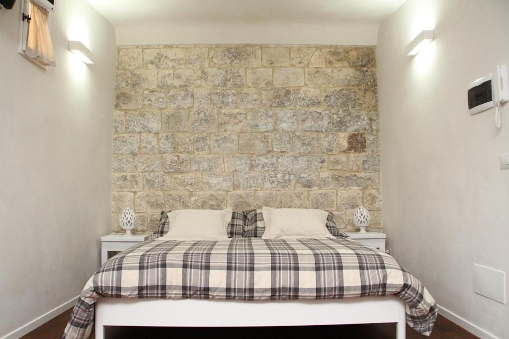 Postel nebo postele na pokoji v ubytování Alla Corte del Conte