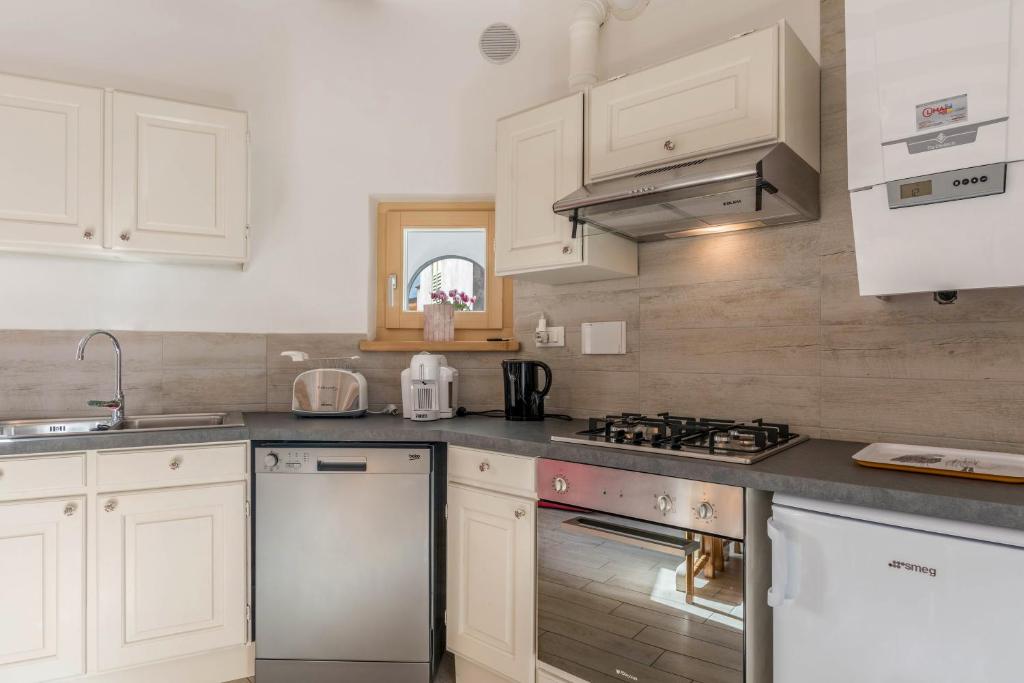 Kuchyň nebo kuchyňský kout v ubytování Casa di Ada