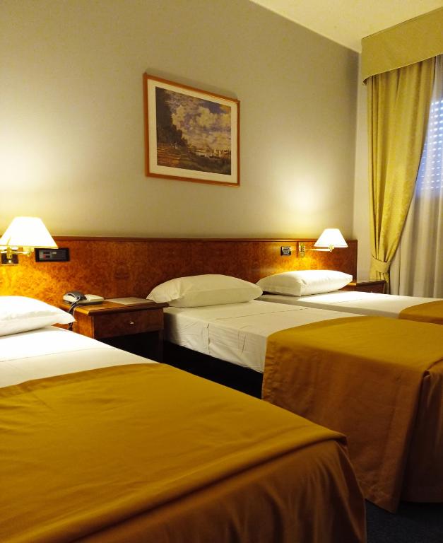 Posteľ alebo postele v izbe v ubytovaní Hotel Motel Europa