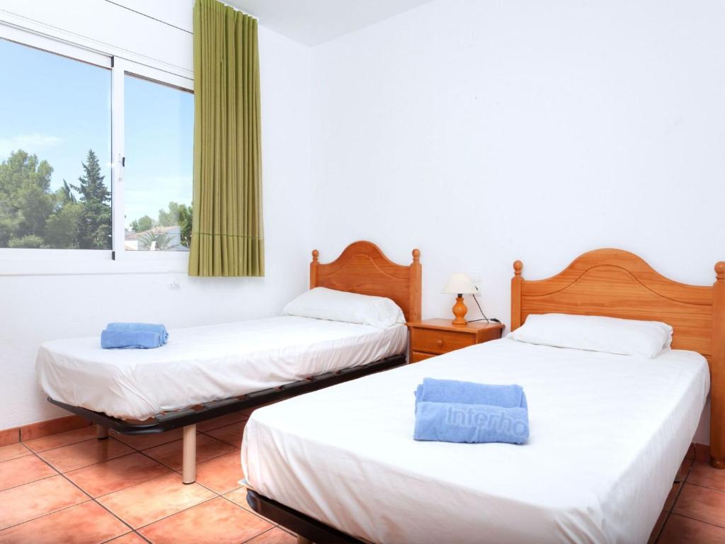 Posteľ alebo postele v izbe v ubytovaní Villa Villa Cala Nova A by Interhome