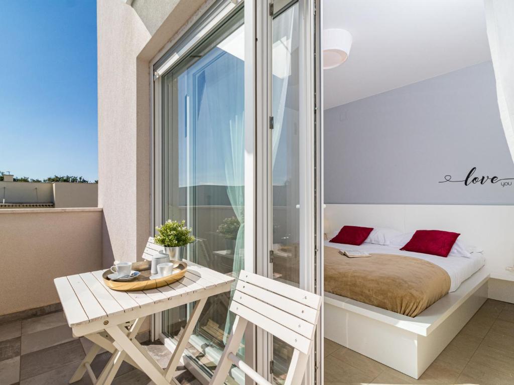 Łóżko lub łóżka w pokoju w obiekcie Holiday Home Villa Virtus by Interhome
