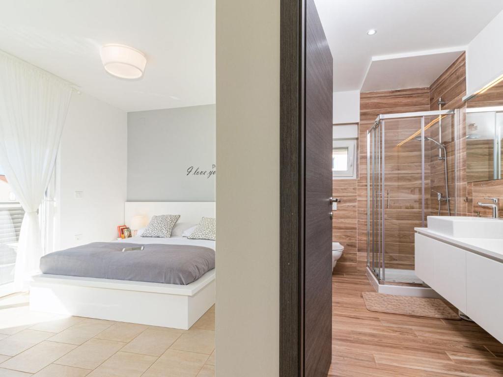 Łóżko lub łóżka w pokoju w obiekcie Holiday Home Villa Virtus by Interhome