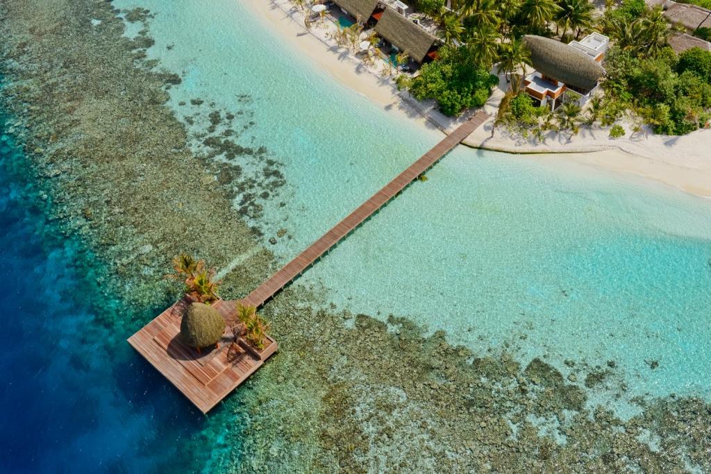 an aerial view of a tropical island with a beach at Kandolhu Maldives in Himandhoo 