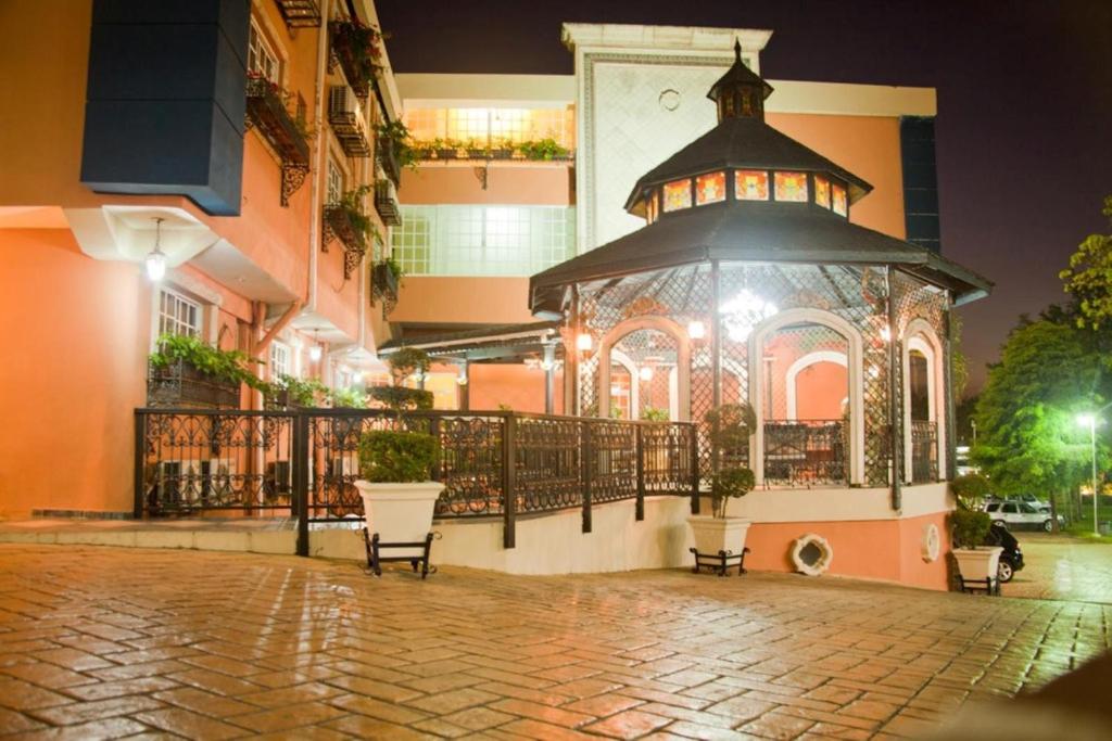 a large gazebo on the side of a building at Platino Hotel &amp; Casino in Santiago de los Caballeros