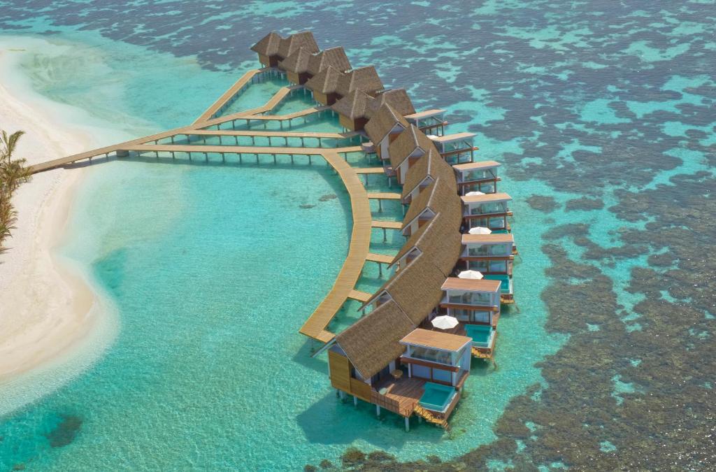 an aerial view of a resort on a beach at Kandolhu Maldives in Himandhoo 