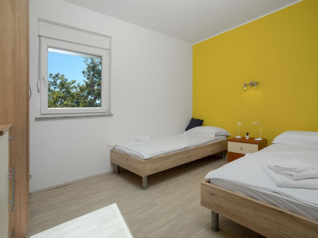 Postel nebo postele na pokoji v ubytování Holiday Home Lavendel by Interhome