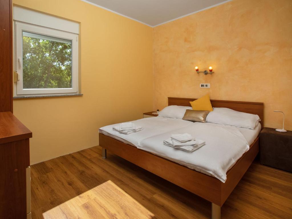 Postel nebo postele na pokoji v ubytování Holiday Home Lavendel by Interhome