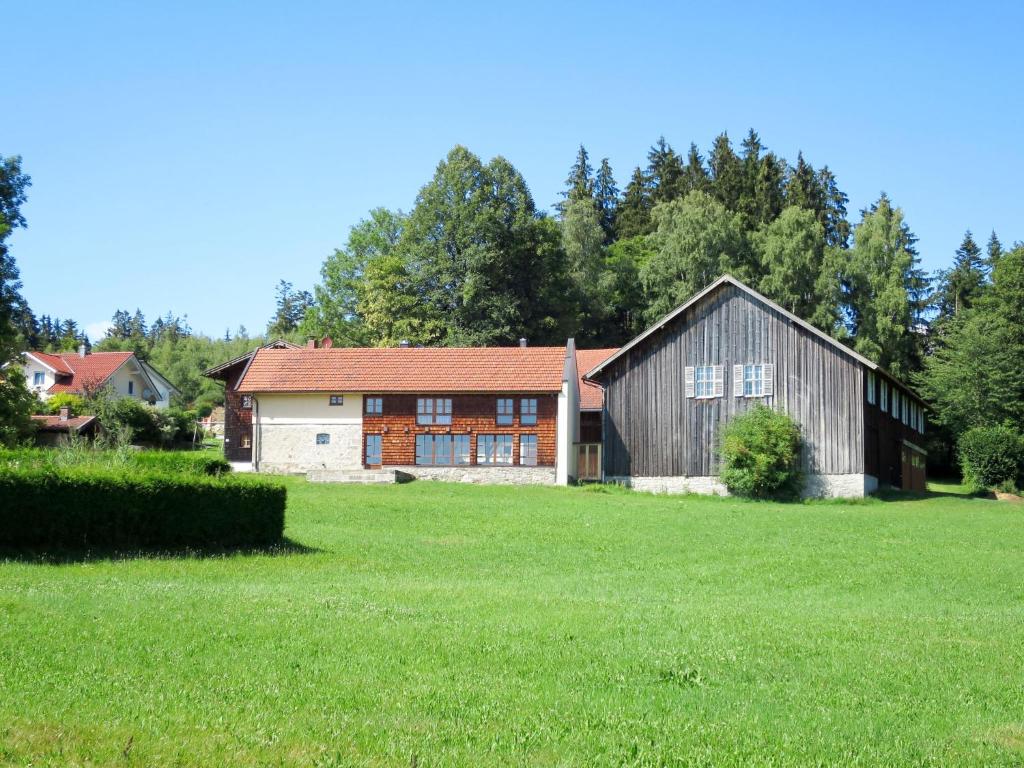 a barn with a grass field in front of it at Holiday Home Mader by Interhome in Hochbruck
