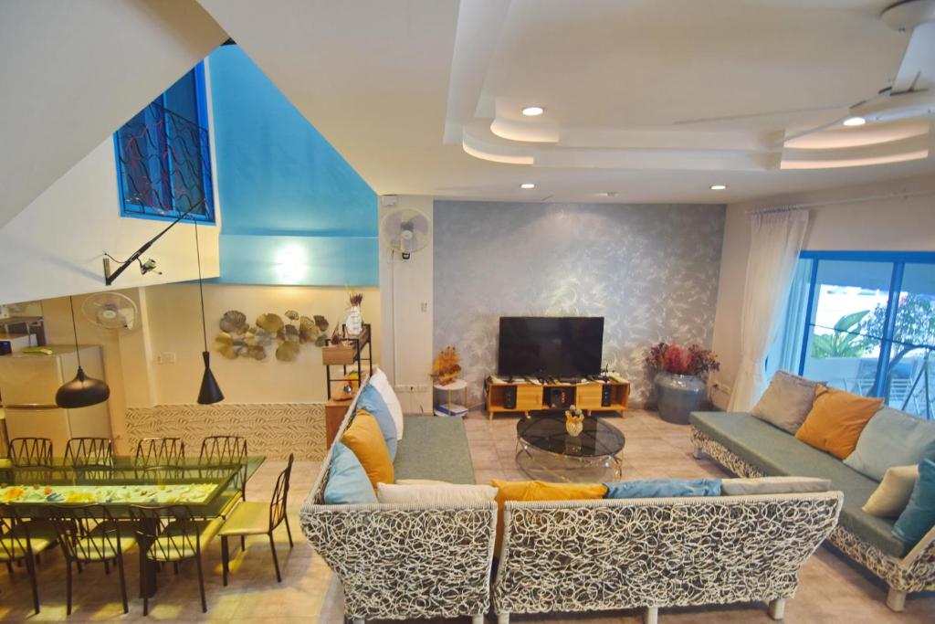 TV a/nebo společenská místnost v ubytování Blu Beach Haven