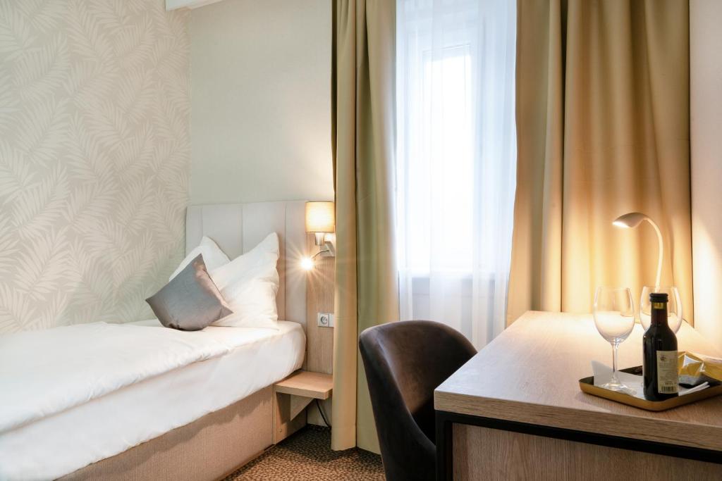 Postel nebo postele na pokoji v ubytování Hotel Karolina