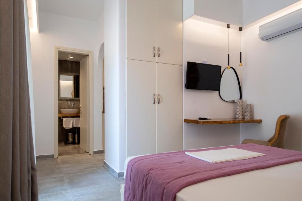 Łóżko lub łóżka w pokoju w obiekcie Corina Studios-Apartments