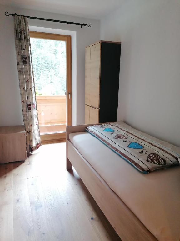 Postel nebo postele na pokoji v ubytování Alpen-Appartement Auerhof