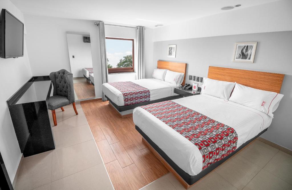 Postel nebo postele na pokoji v ubytování Six Hotel Guadalajara Expiatorio