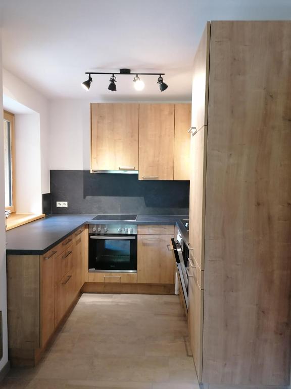 Kuchyň nebo kuchyňský kout v ubytování Alpen-Appartement Auerhof