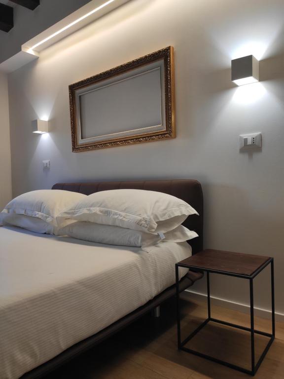 Postel nebo postele na pokoji v ubytování Borgo di Ponte Holiday Apartments & Rooms