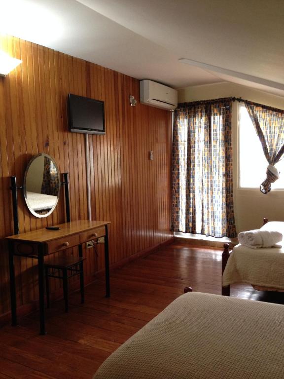 Una cama o camas en una habitación de Hotel Posada Los Delfines