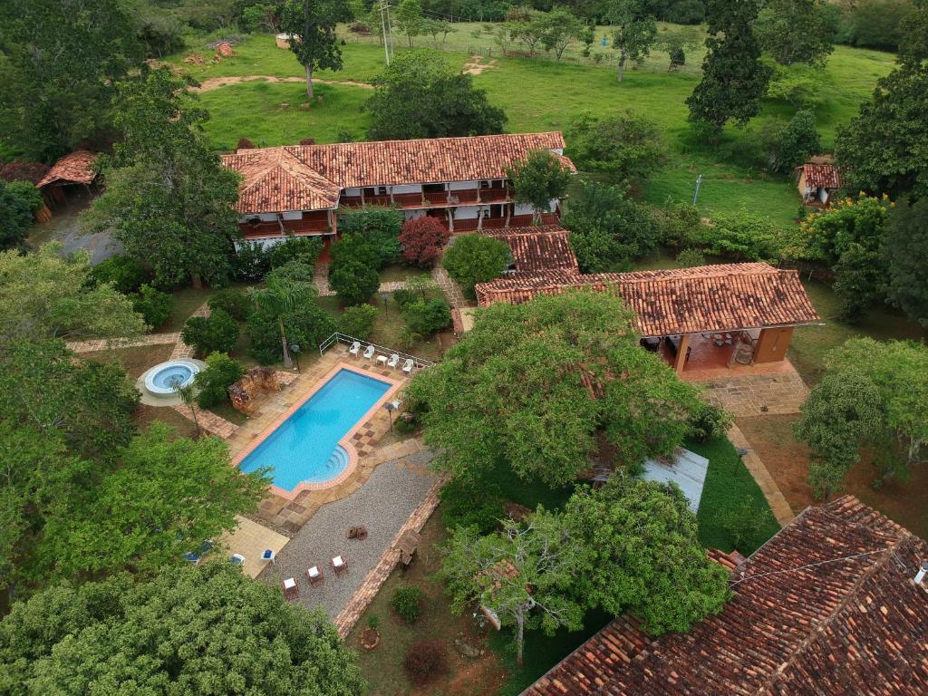 an aerial view of a house with a swimming pool at Hotel Hacienda Macedonia in Barichara