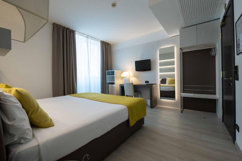 Postel nebo postele na pokoji v ubytování La Pieve Hotel