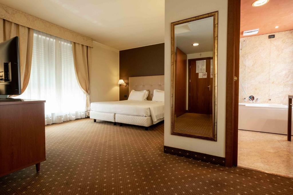Postel nebo postele na pokoji v ubytování La Pieve Hotel