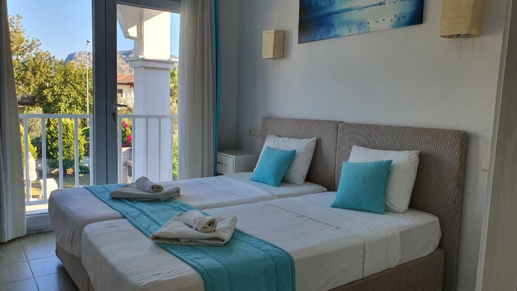 Postel nebo postele na pokoji v ubytování Dalyan Villa Amazon
